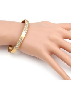 Sophisticated Gold Tone Hinged Bangle Bracelet with Brushed Finish and Sparkling Crystals